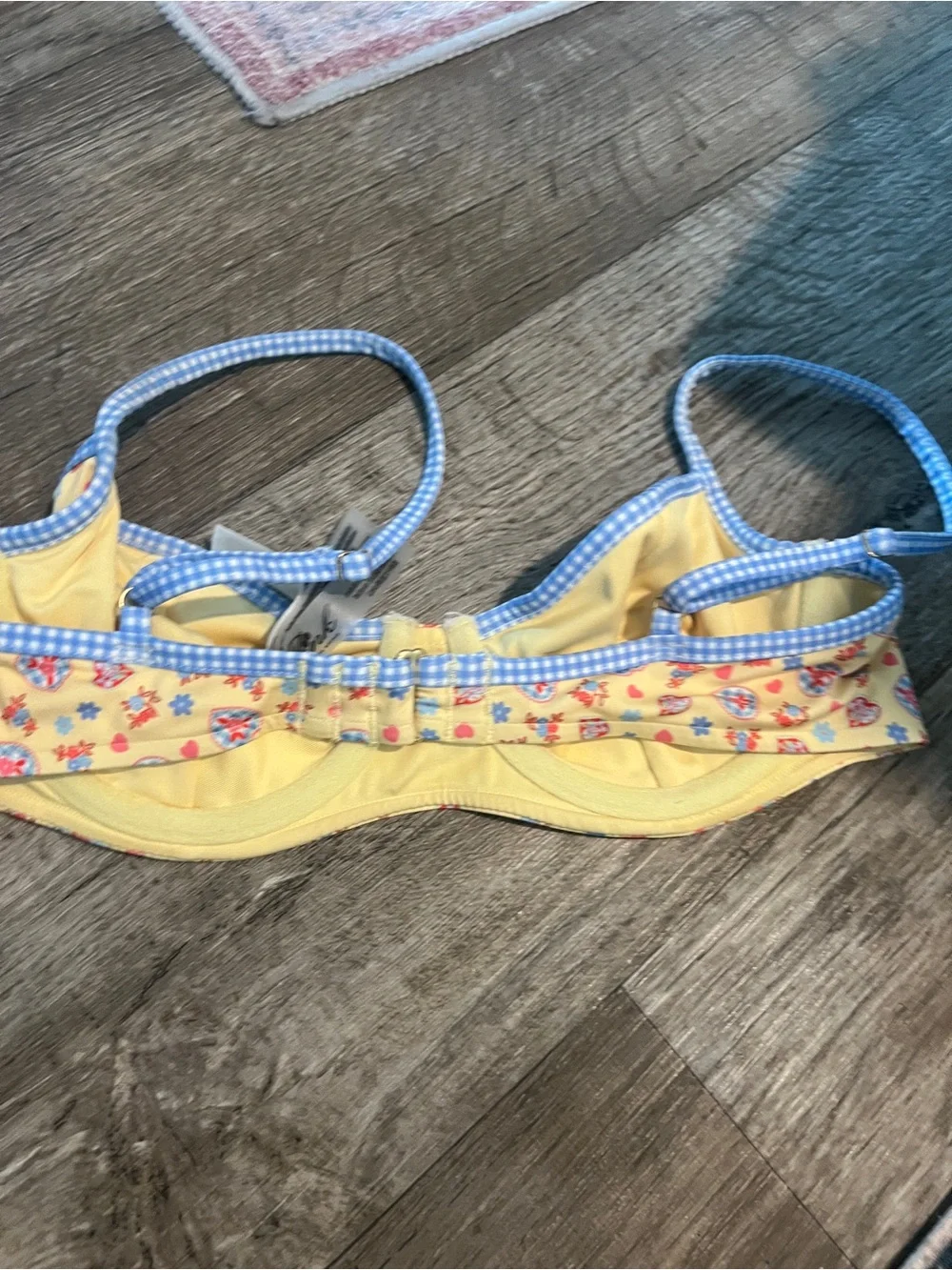 Frankie’s bikinis vs pink buttercup bikini top in yellow and blue